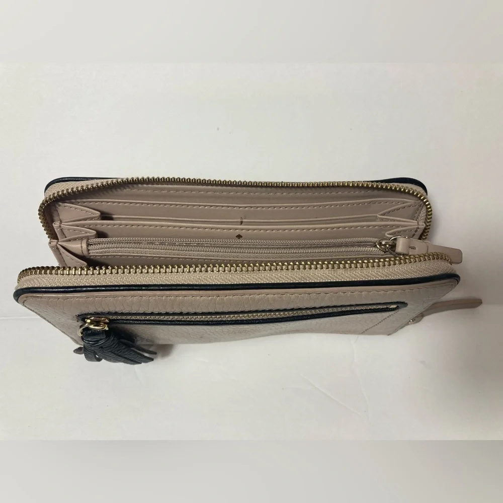Kate Spade wallet pebble texture leather mauve color black trim tassel